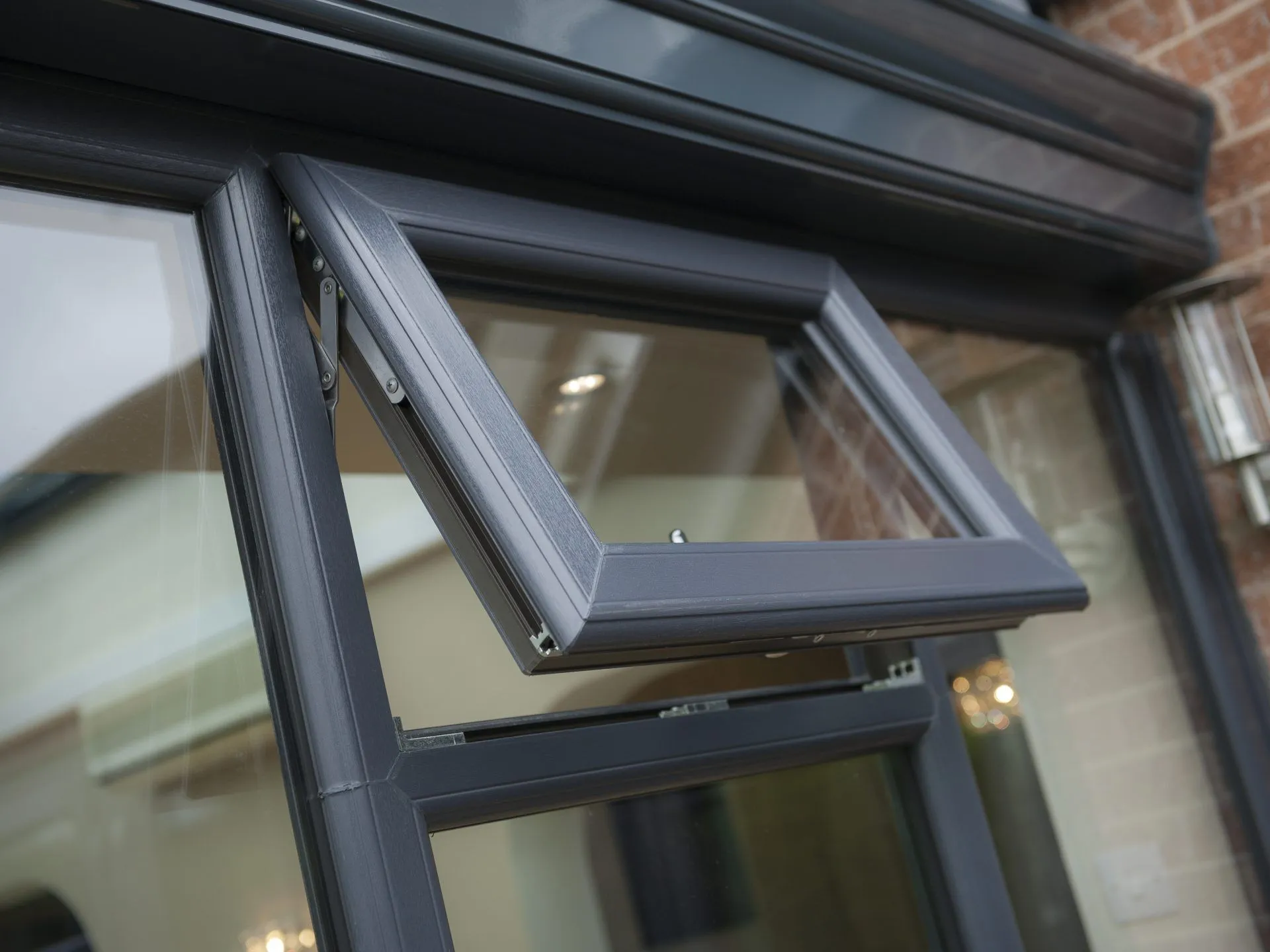 Grey top-opening upvc window by endeavour windows
