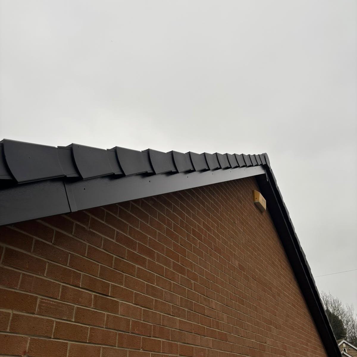Anthracite grey fascias and dry verge on a gable end