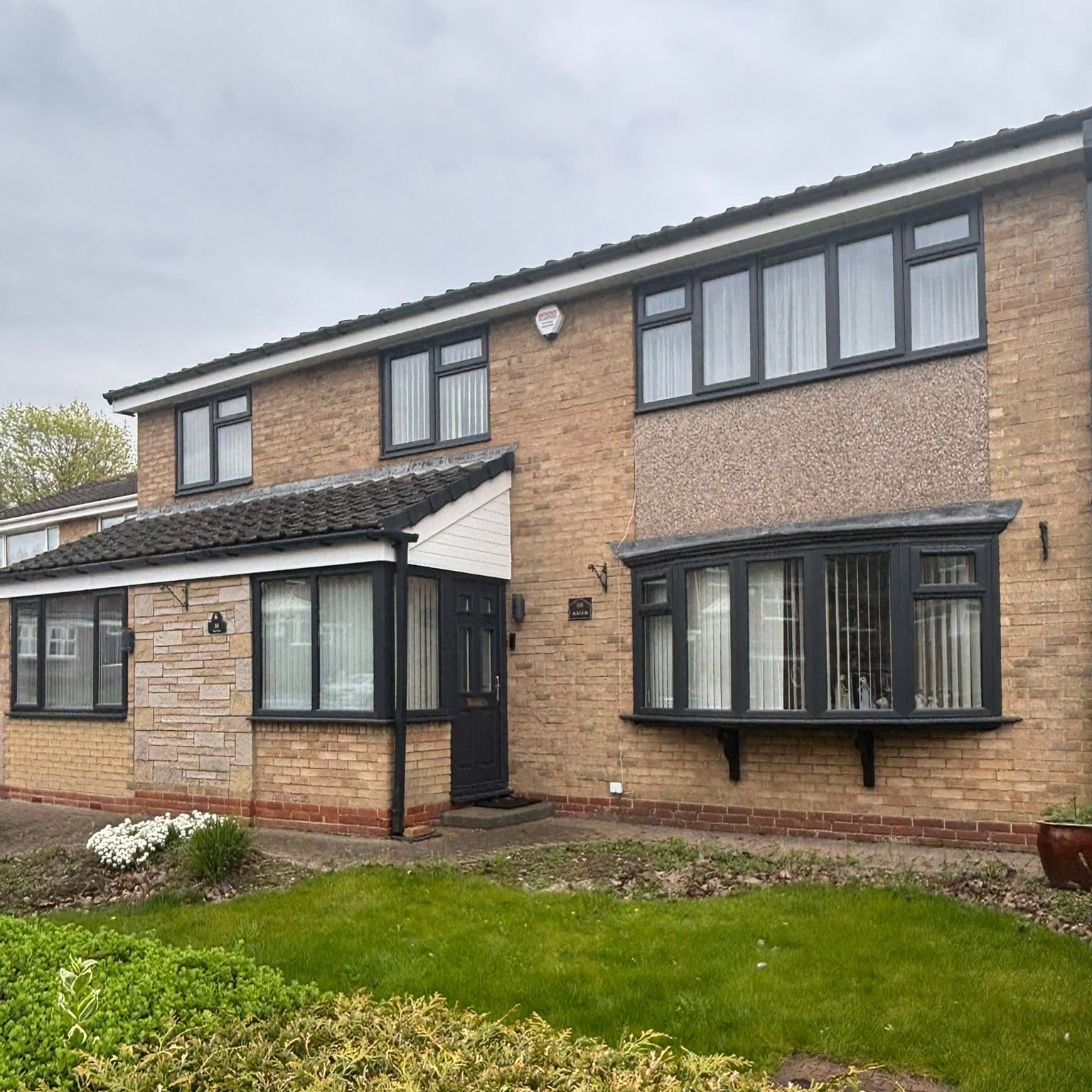 Family home with anthracite grey windows and roofline upgrade